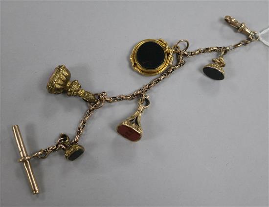 A 9ct gold bracelet, hung with five assorted fobs including four seals.